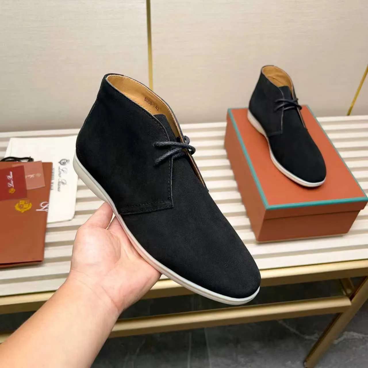 Men's Shoes 💰420 Loro Piana reimagines the desert boot—a modern, comfortable interpretation of a classic 1940s style. Crafted from suede calfskin, it exudes elegance. The tight texture of suede calfskin is not only durable but also looks casual and sophisticated. Add a timeless piece to your shoe collection, harmoniously blending comfort, style and Loro Piana's heritage of craftsmanship. Acetate satin detail on the inside White sole with LP lettering for added traction Space for a personalized signature on the heel Tonal suede trim Upper: 100% cow split suede Sole: 100% Rubber lining: Cow leather